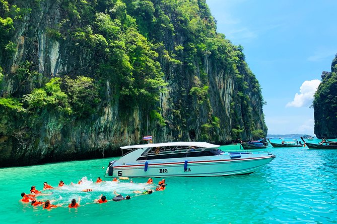 A breathtaking view of Phi Phi Island's crystal-clear turquoise waters and lush greenery.