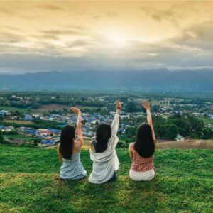 "A group of women enjoying a guided hiking tour in the picturesque mountains."