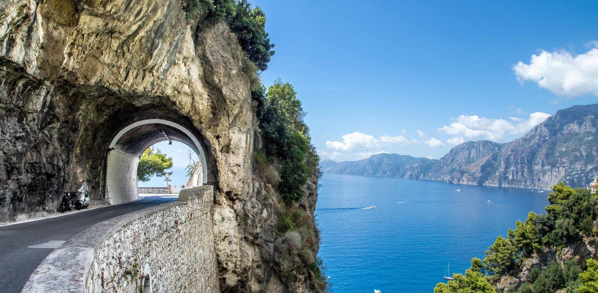 Rome & Positano Tour : Scenic view of the winding road along the picturesque Amalfi Coast, Italy.